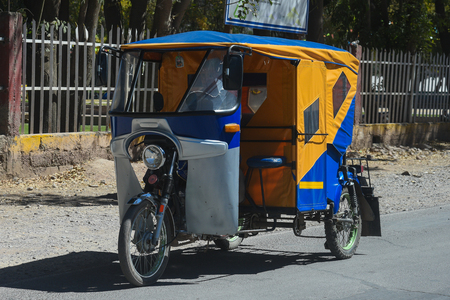Cuzco / Peru - 07.11.2017: Funny moped taxi in Cuzco Peru