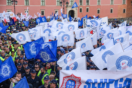 Warsaw / Poland - October.02.2018: Demonstration, national protest of police officers for fair work wages. Crowd of police officers gathered in the old town holding flags and banners.のeditorial素材