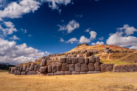 Sacsayhuaman ruins in Cusco, Peru. A monumental complex of stone buildings made by Incas. Pre Columbian megalithic fortified constructions often visited by tourists.の写真素材