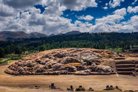 Sacsayhuaman ruins in Cusco, Peru. A monumental complex of stone buildings made by Incas. Pre Columbian megalithic fortified constructions often visited by tourists.の写真素材
