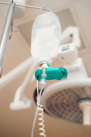 Iv fluid, intravenous with sodium chloride applying to the patient in the hospital.の写真素材