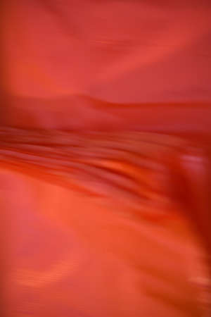 abstract, red, fluid background texture, close-up, full frame