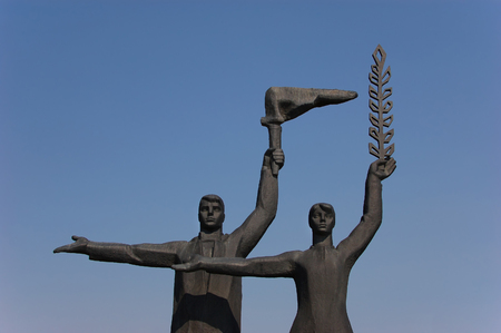 Statue of factory worker and collective farm worker in Novosibirskの写真素材