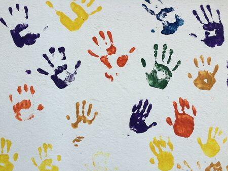 Colorful child hands on the wallの素材
