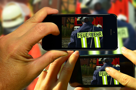 sightseers photograph firefighters during deployment