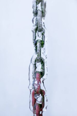 Detail of a chain covered with fresh ice