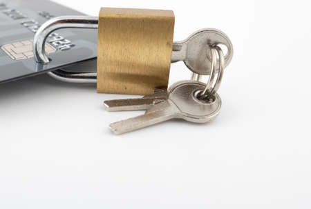 A lock through a credit card as a concept for security of a bank account.
