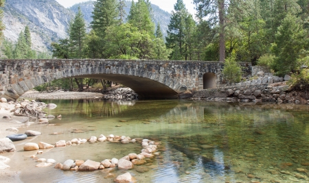 Crystal clear spring and a beautiful stone bridge in Yosemite Valley.の写真素材