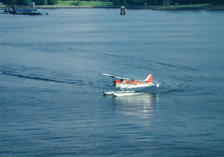 A floatplane is carrying cruiseline passengers to the Vancouver terminal.
