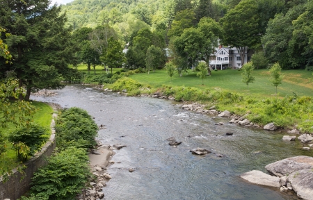 This Vermont river, the Ottauquechee, flows right through the middle of the small town of Woodstock の写真素材