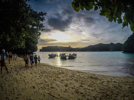 Sunset Boat Landing In The Palau Islandsのeditorial素材