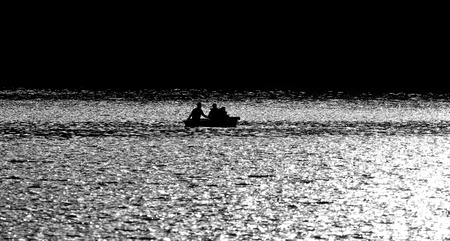 Boating Sillouette on a Northern Lake Canadaの写真素材