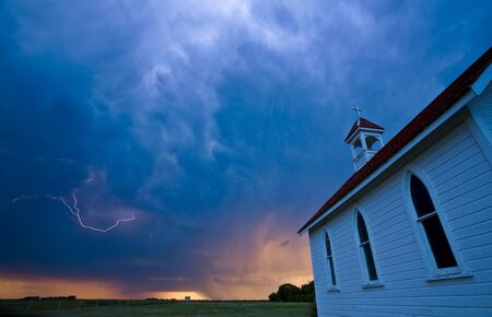 Storm Clouds over Saskatchewan country churchの写真素材