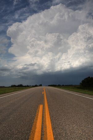 Storm clouds down a Saskatchewan highwayの写真素材