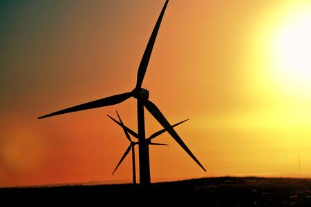 Sun glare upon Alberta windfarmの写真素材