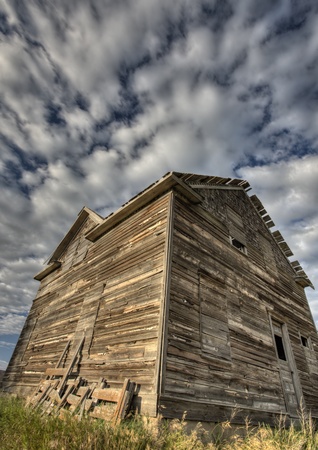 Abandoned Farmhouse Saskatchewan Canada sunset and prairie viewの写真素材