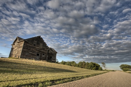 Abandoned Farmhouse Saskatchewan Canada sunset and prairie viewの写真素材