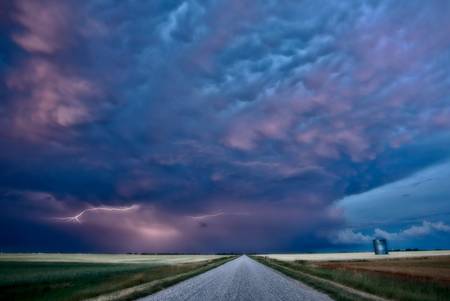 Night Lightning Canada Saskatchewan Prairie storm and roadの写真素材