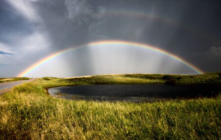 Saskatchewan Storm Rainbow overfield and slough pond hailの写真素材
