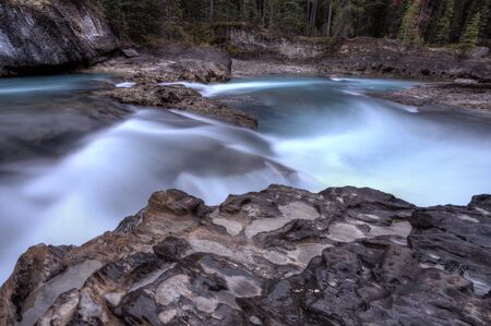 Blurred water flowing British Columbia Canadaの写真素材