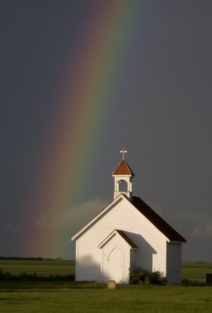 Country Church and Rainbow after storm Canadaの写真素材
