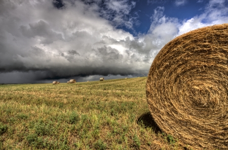 Storm Clouds Saskatchewan hay bales in Canadaの写真素材