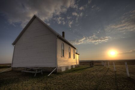 Storm Clouds Saskatchewan with country church at sunsetの写真素材