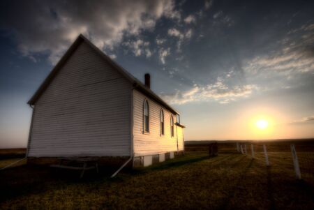 Storm Clouds Saskatchewan with country church at sunsetの写真素材