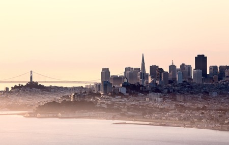 San Fransisco Skyline fog rolling in morning sunriseの写真素材