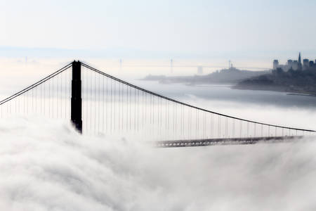 San Fransisco Skyline fog rolling in morning sunriseの写真素材