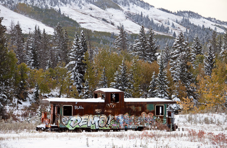 Fall Colors Kananaskis Abandoned Train Car snowfall Aberta