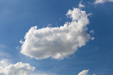 Blue sky background with cloudsの写真素材