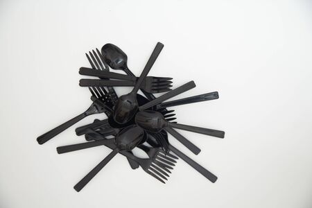 Plastic spoons and forks That is arranged in a lineの写真素材