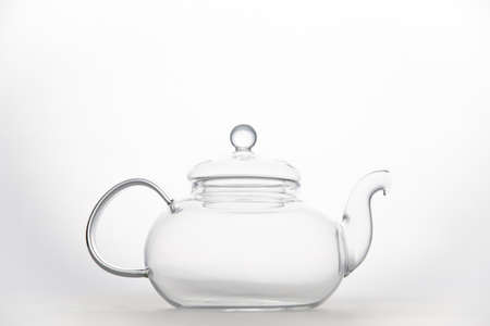 Transparent empty glass teapot isolated on white backgroundの写真素材
