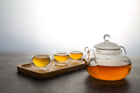 The hot tea and cup on a white background.の写真素材