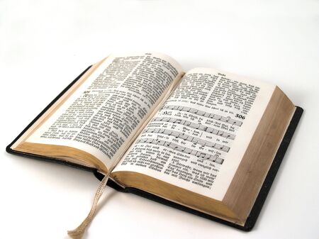 old open songbook with gilt edge isolated on a white background