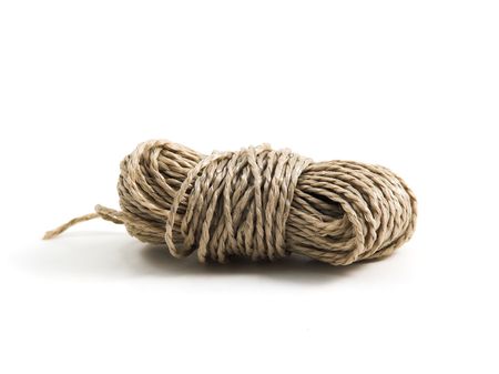 piece of rolled up string on white backgroundの写真素材