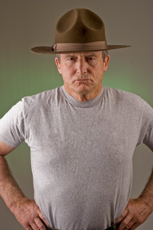 Older man posed as drill instructor.の写真素材