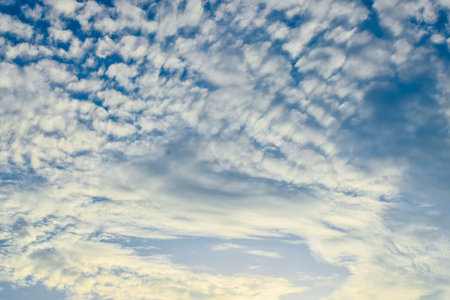 Abstract photo of cloudscape during evening time with blue sky with different natural patterns of...