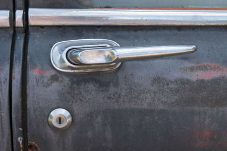 close up of a door buckle of an old rusty carの写真素材