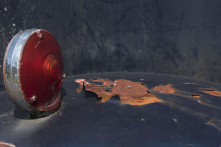 Close-up of a rotten boundary light with chipped paintの写真素材