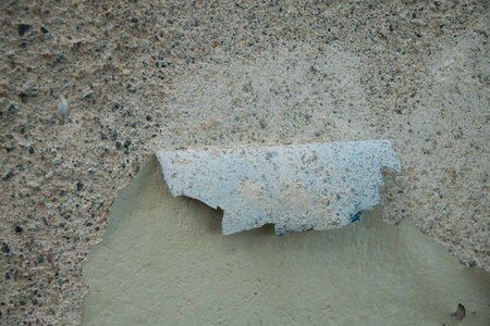 old wall with peeling paint to use as backgroundの写真素材
