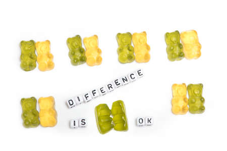 Rows of mixed pairs of gummy bears in which one behaves differently as a concept for same-sex love...