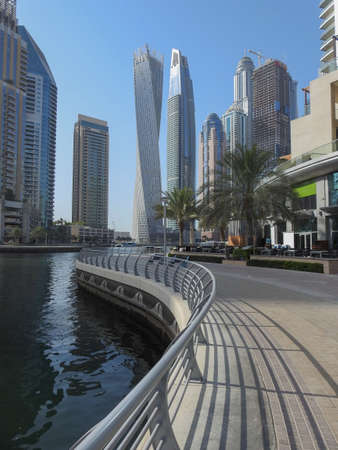 Skyscrapers in Dubai Marina with walkway in the foregroundの写真素材