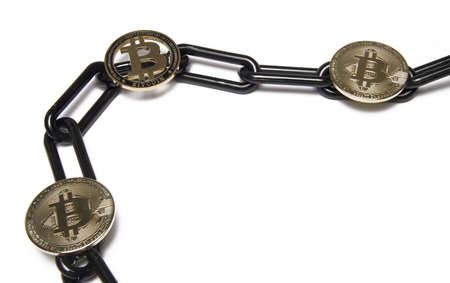 Close up of gold bitcoin coins on black chain isolated on white background as concept for blockchain...
