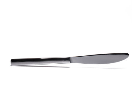 Close up of metal knife butter knife isolated on white background