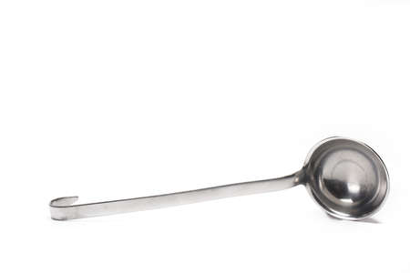 Close up of silver metal soup ladle isolated on white backgroundの写真素材