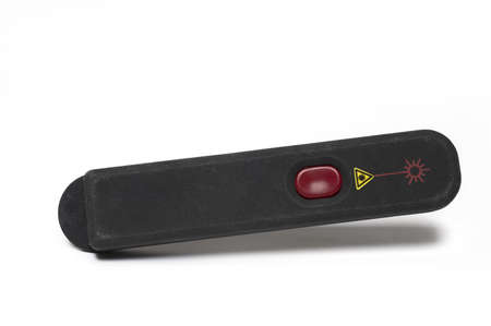 Close-up of a dark laser pointer for use in presentations on a white backgroundの写真素材