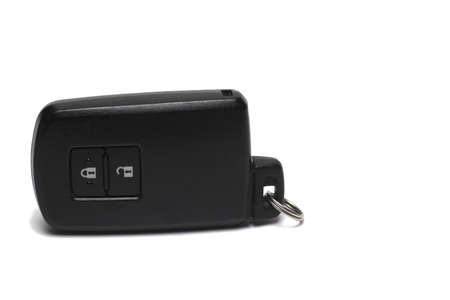 Close up of modern black car key with remote control for unlocking and locking car doors and trunk...