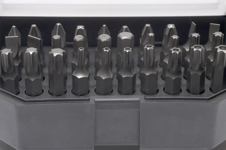 Close-up of professional tool case box container with presented in orderly fashion bits and...